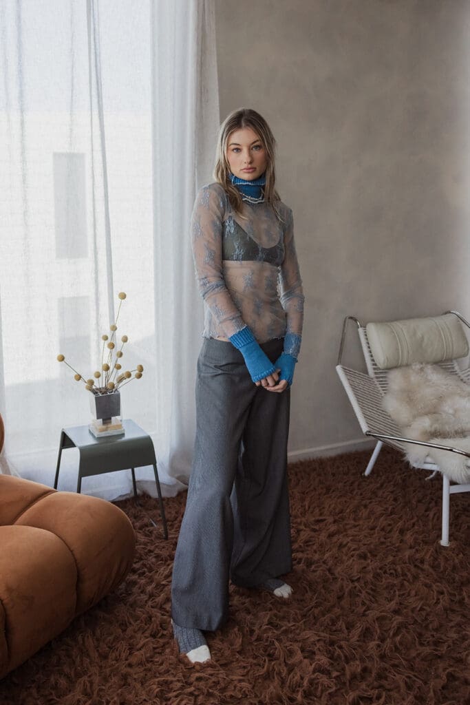 Model wearing knitwear from As They Kiss Consume. Photo by Solitude Creative. Photography for conscious brands