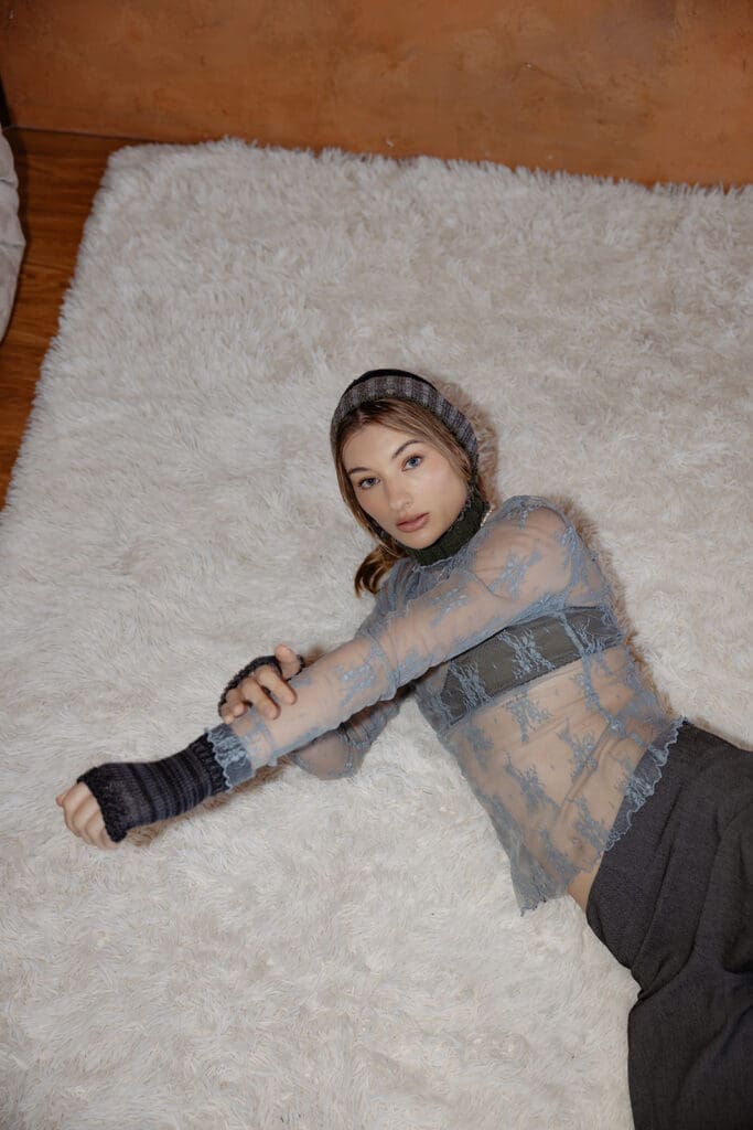 Model wearing knitwear from As They Kiss Consume. Photo by Solitude Creative. Photography for conscious brands